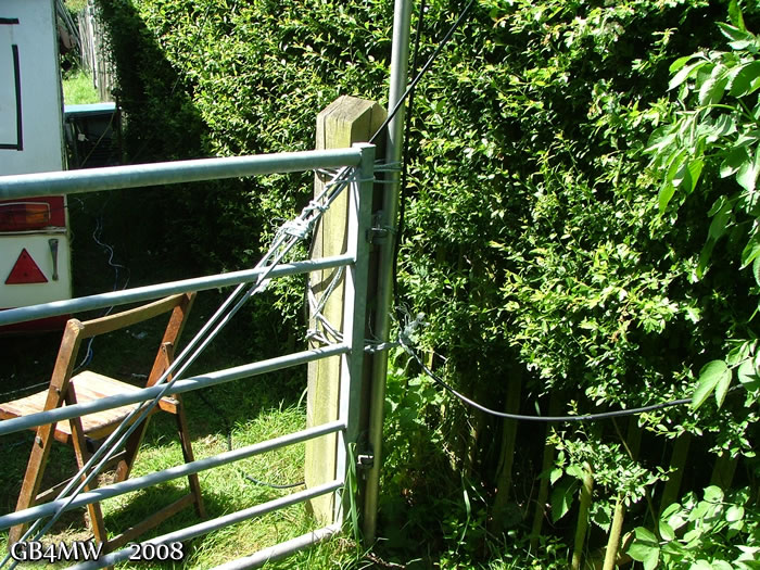 VHF mast roped to a gate post.
